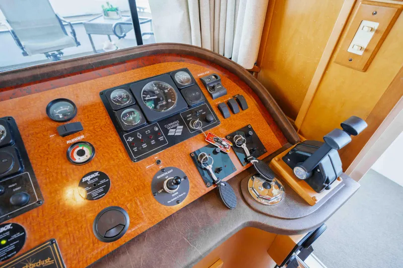 Yacht Photos Pics Control panel of a 2004 Stardust Cruisers houseboat with gauges and switches.