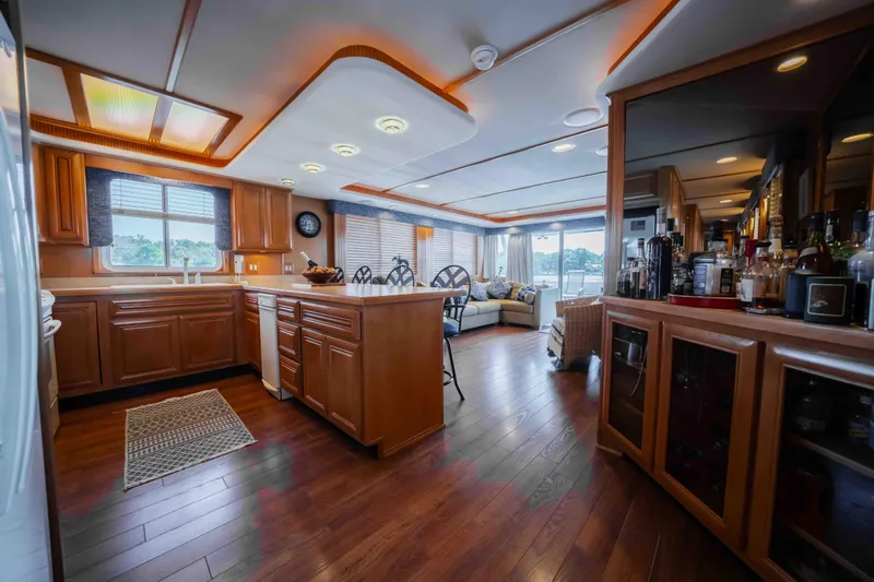  Yacht Photos Pics Luxurious 2004 Stardust Cruisers houseboat interior with modern kitchen and cozy living area.