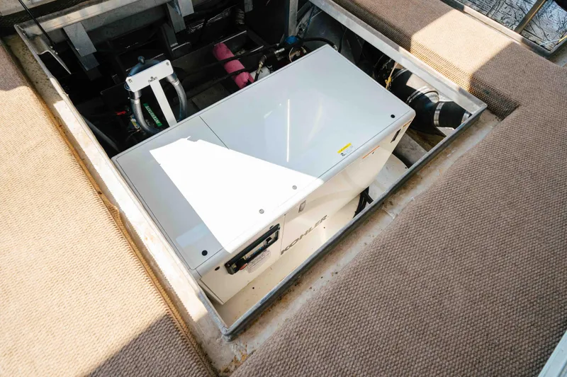  Yacht Photos Pics Engine compartment of a 2004 Stardust Cruisers houseboat, featuring a Kohler generator.