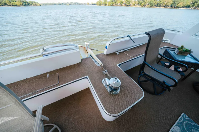  Yacht Photos Pics 2004 Stardust Cruisers houseboat deck with seating, overlooking serene lake view.