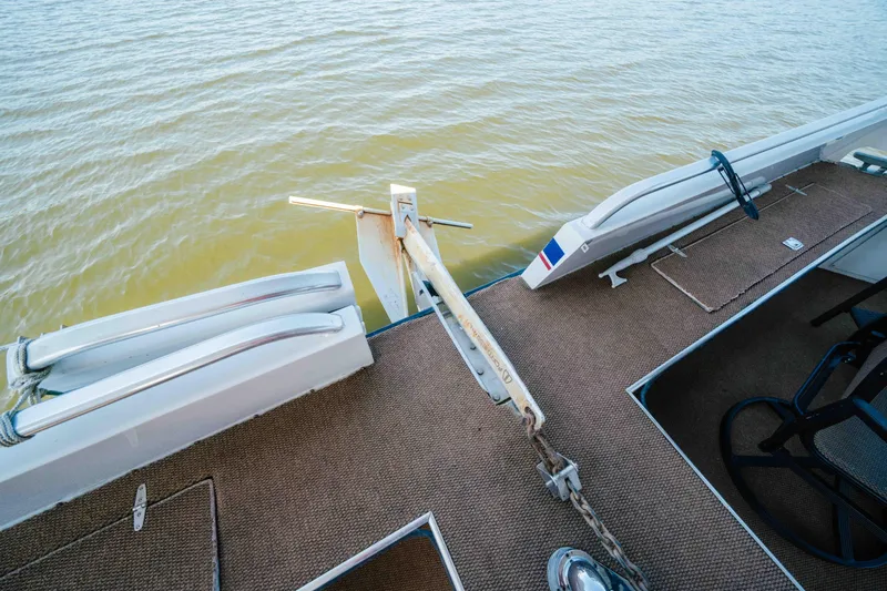  Yacht Photos Pics 2004 Stardust Cruisers houseboat deck with anchor and water view.