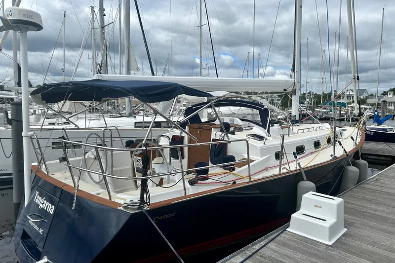 Tangaroa Yacht Photos Pics Sailboat Tartan 4000, 2015 model, docked at marina under cloudy skies.