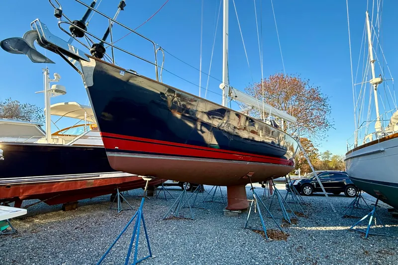 Tangaroa Yacht Photos Pics Sailboat Tartan 4000, 2015 model, on stands in a boatyard under clear blue sky.