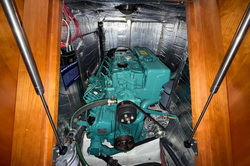 Tangaroa Yacht Photos Pics Engine compartment of a 2015 Tartan 4000 sailboat, featuring a green marine engine.