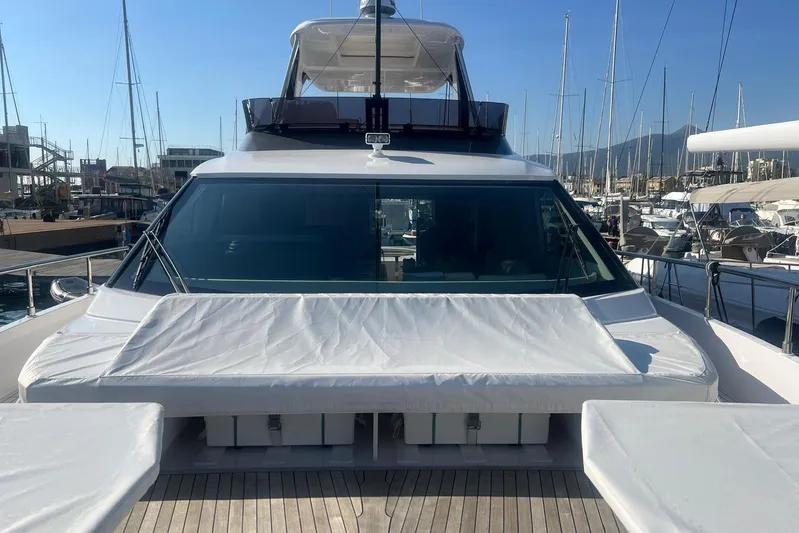  Yacht Photos Pics 2025 Ferretti Yachts 670 docked at marina, showcasing sleek design and luxury features.