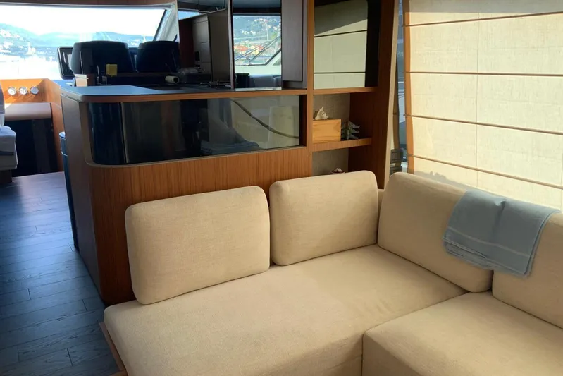  Yacht Photos Pics Luxurious interior of 2025 Ferretti Yachts 670 with modern seating and elegant design.
