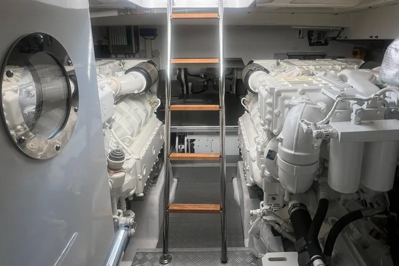  Yacht Photos Pics Engine room of 2025 Ferretti Yachts 670, featuring dual engines and ladder access.