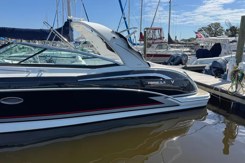  Yacht Photos Pics 2014 Formula 350 Sun Sport boat docked at marina under clear blue sky.