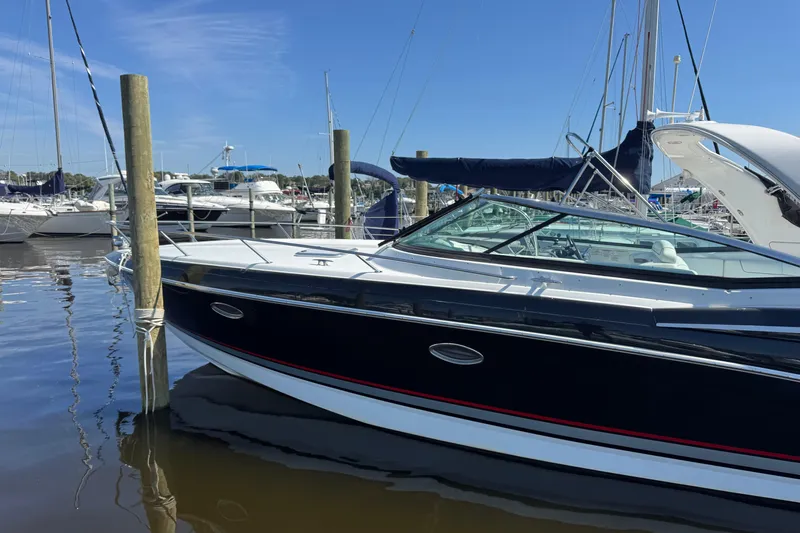  Yacht Photos Pics 2014 Formula 350 Sun Sport boat docked in a marina under clear blue skies.
