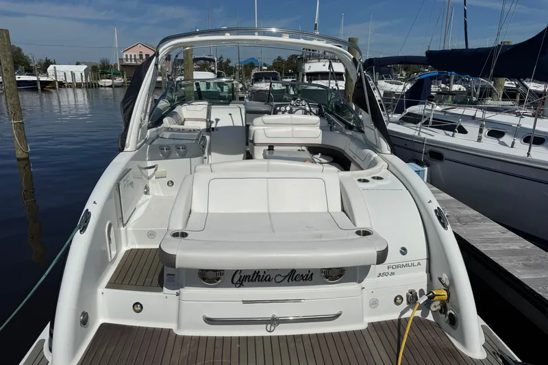  Yacht Photos Pics 2014 Formula 350 Sun Sport boat docked at marina, featuring spacious seating and sleek design.