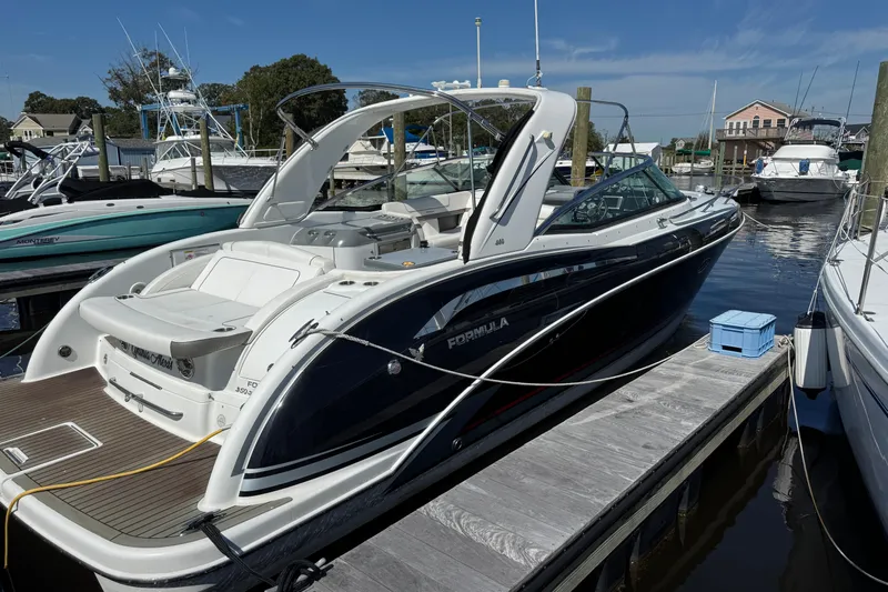  Yacht Photos Pics 2014 Formula 350 Sun Sport boat docked at a marina under clear blue skies.