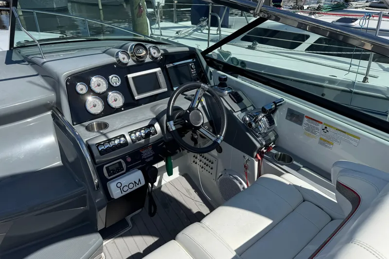  Yacht Photos Pics 2014 Formula 350 Sun Sport boat cockpit with steering wheel and control panel.