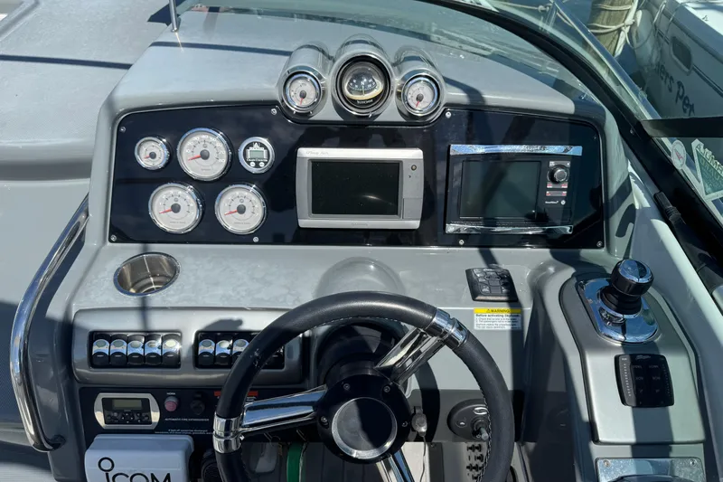  Yacht Photos Pics Dashboard of a 2014 Formula 350 Sun Sport boat with gauges and controls.