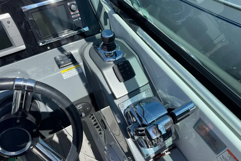  Yacht Photos Pics Control panel of 2014 Formula 350 Sun Sport boat with steering wheel and throttle.