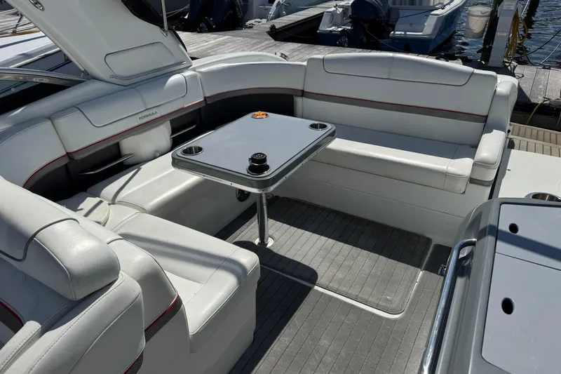  Yacht Photos Pics 2014 Formula 350 Sun Sport boat interior with white seating and a central table.