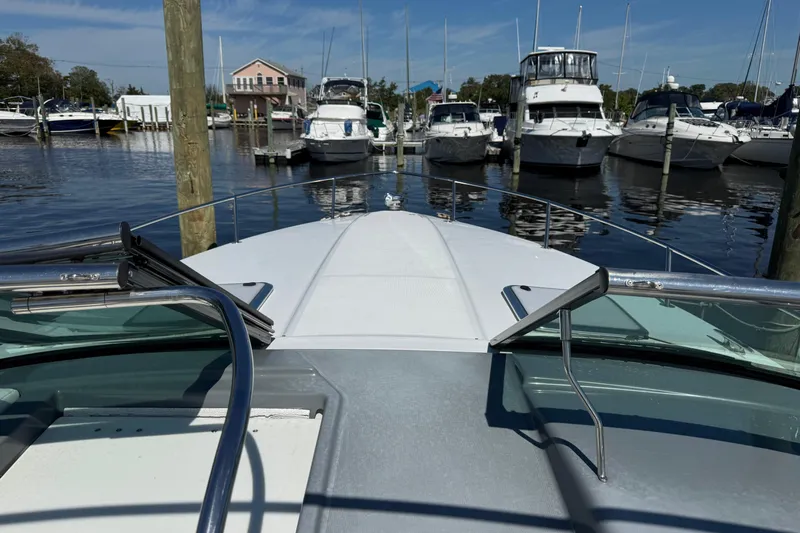  Yacht Photos Pics 2014 Formula 350 Sun Sport boat docked at marina with other vessels.