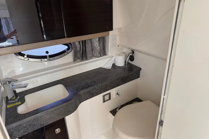  Yacht Photos Pics 2014 Formula 350 Sun Sport bathroom with sink, countertop, and toilet.