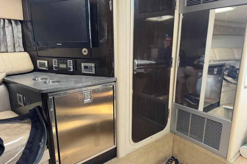  Yacht Photos Pics Interior of 2014 Formula 350 Sun Sport with TV, fridge, and seating area.