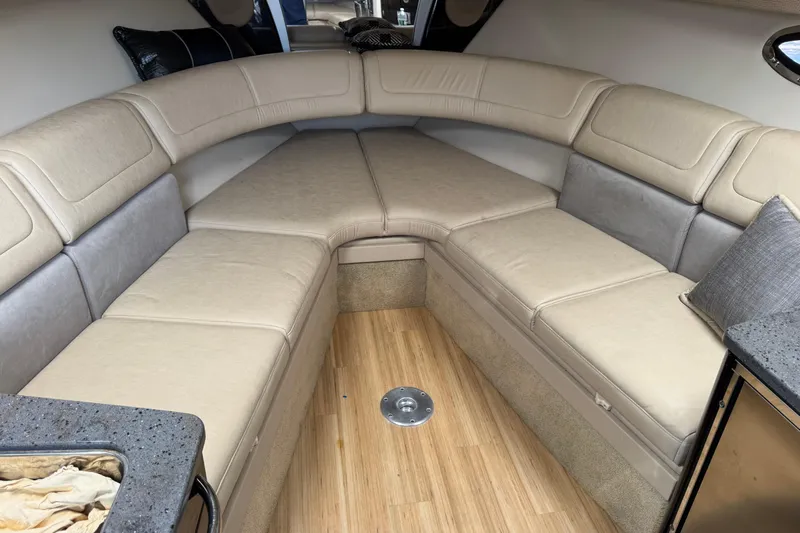  Yacht Photos Pics 2014 Formula 350 Sun Sport interior with beige seating and wood flooring.