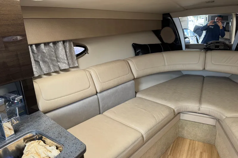  Yacht Photos Pics Interior of 2014 Formula 350 Sun Sport boat with beige seating and kitchenette.