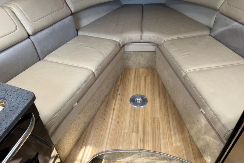  Yacht Photos Pics 2014 Formula 350 Sun Sport cabin interior with beige seating and wooden flooring.