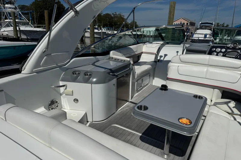 Yacht Photos Pics 2014 Formula 350 Sun Sport boat interior with white seating and table.