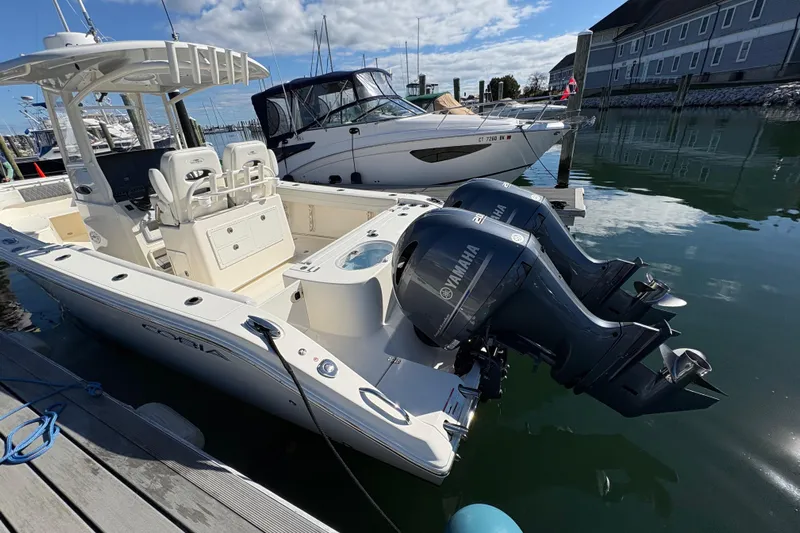  Yacht Photos Pics 2022 Cobia 280 Center Console boat docked with twin Yamaha engines.
