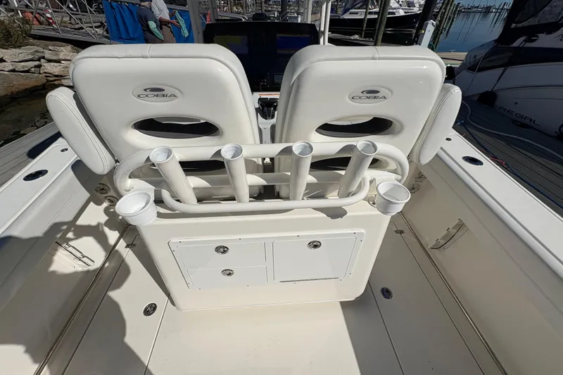  Yacht Photos Pics 2022 Cobia 280 Center Console boat interior with rod holders and storage compartments.