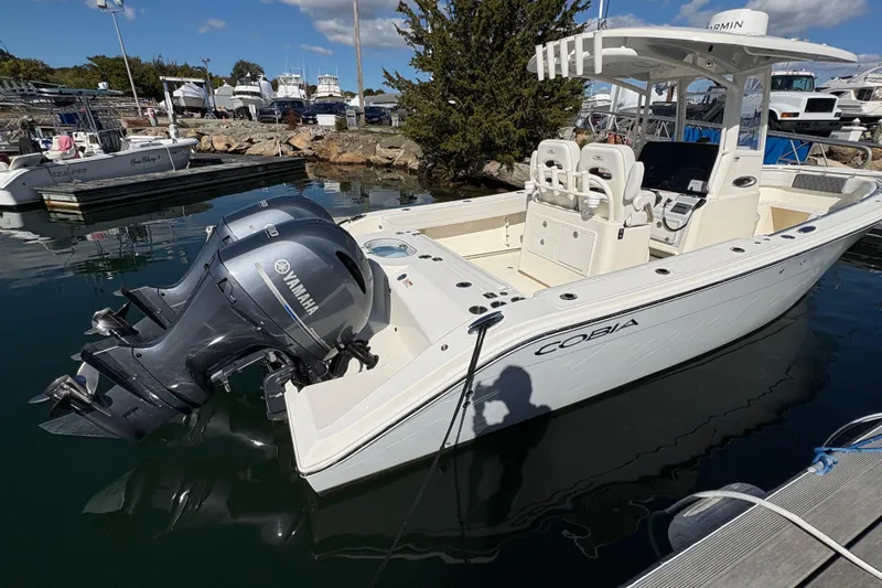  Yacht Photos Pics 2022 Cobia 280 Center Console boat with Yamaha engines docked at marina.