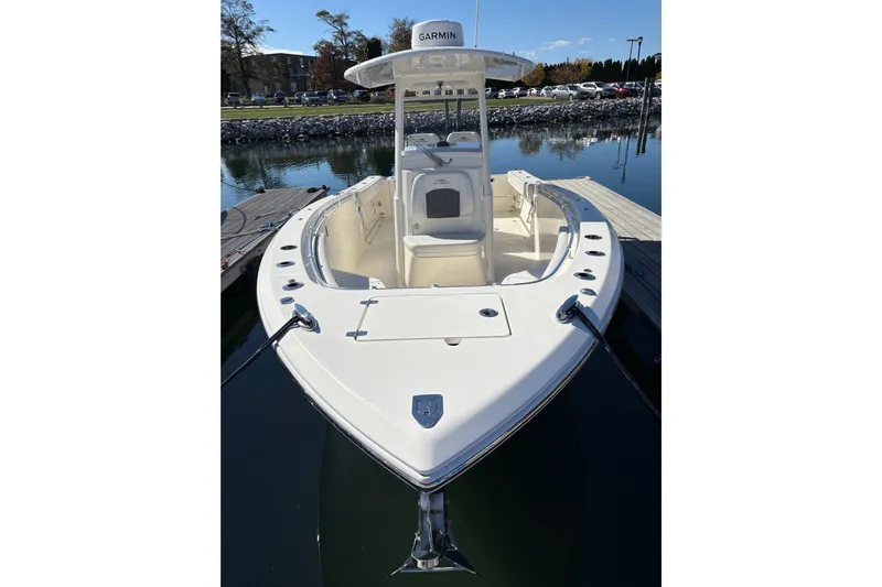  Yacht Photos Pics 2022 Cobia 280 Center Console boat docked on calm water.