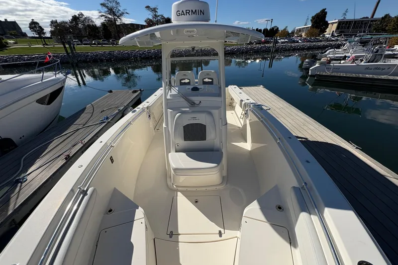  Yacht Photos Pics 2022 Cobia 280 Center Console boat docked at marina, featuring Garmin equipment.