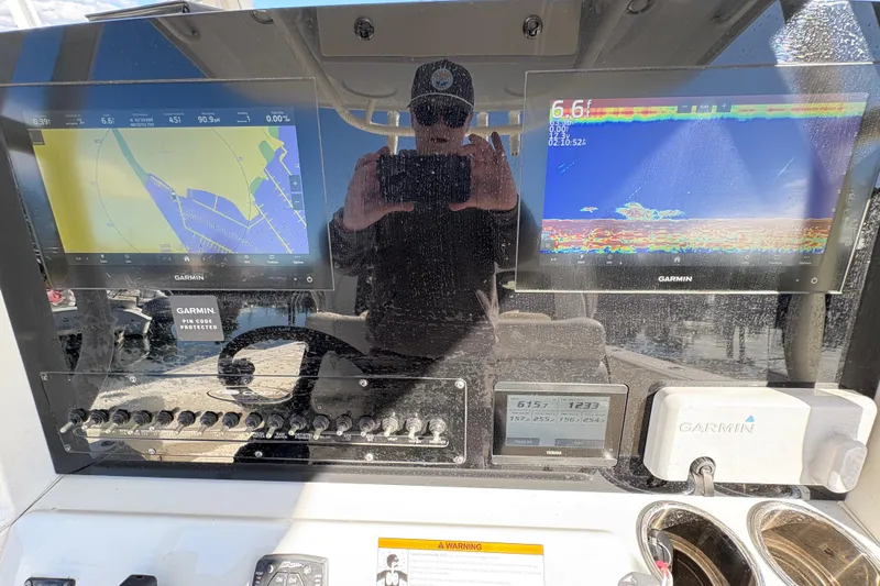  Yacht Photos Pics Cobia 280 Center Console 2022 dashboard with Garmin navigation displays and controls.