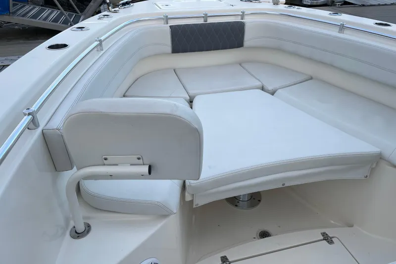  Yacht Photos Pics 2022 Cobia 280 Center Console boat interior with cushioned seating and stainless steel railings.