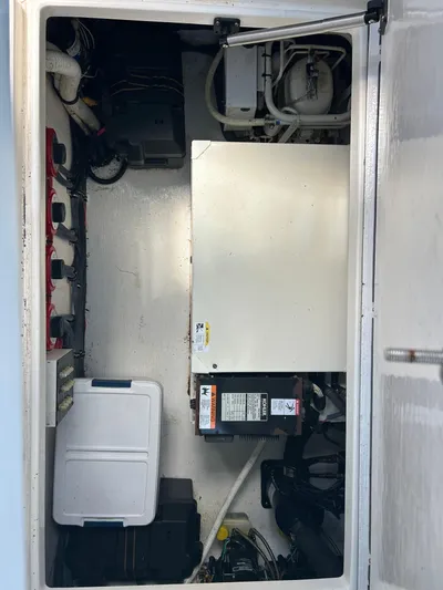  Yacht Photos Pics 2007 Contender 36 Fish Around engine compartment with equipment and storage.