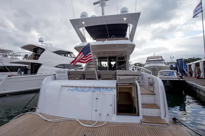  Yacht Photos Pics Mazarin 72 Sport Fly yacht, 2015 model, docked with American flag displayed.