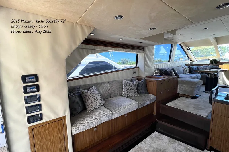  Yacht Photos Pics Luxurious interior of 2015 Mazarin 72 Sport Fly yacht with plush seating and modern design.