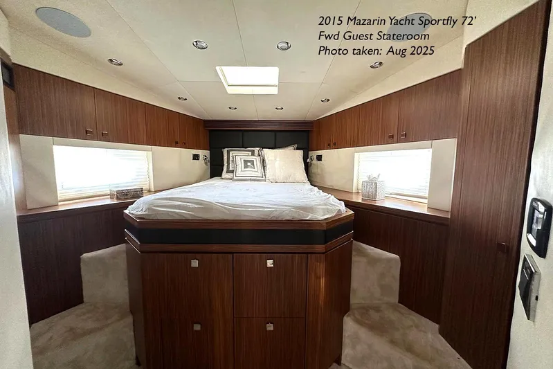  Yacht Photos Pics Luxurious 2015 Mazarin 72 Sport Fly yacht stateroom with elegant wood finishes.