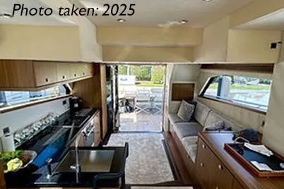  Yacht Photos Pics Interior of 2015 Mazarin 72 Sport Fly yacht, featuring modern kitchen and seating area.