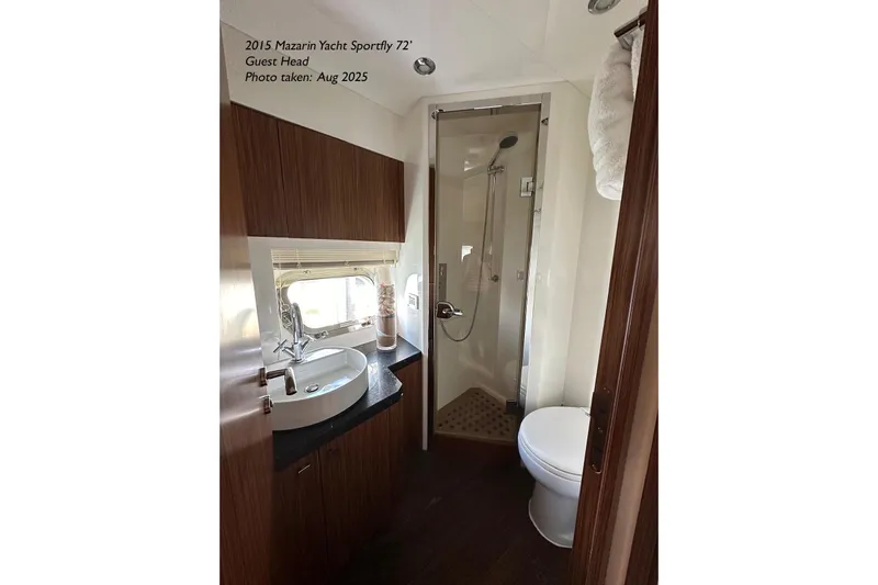  Yacht Photos Pics Luxurious bathroom in 2015 Mazarin 72 Sport Fly yacht, featuring modern fixtures and elegant design.
