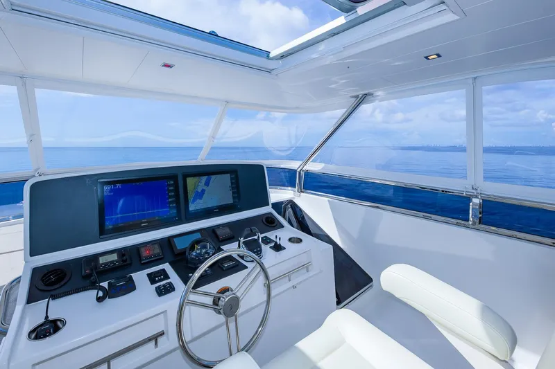  Yacht Photos Pics Luxurious 2019 Regency P65 yacht helm with modern navigation systems and ocean view.