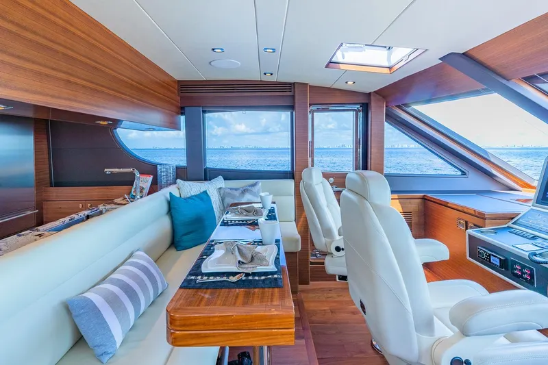  Yacht Photos Pics Luxurious 2019 Regency P65 yacht interior with elegant seating and ocean view.