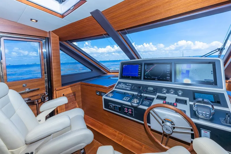  Yacht Photos Pics Luxurious 2019 Regency P65 yacht helm with advanced navigation systems and ocean view.