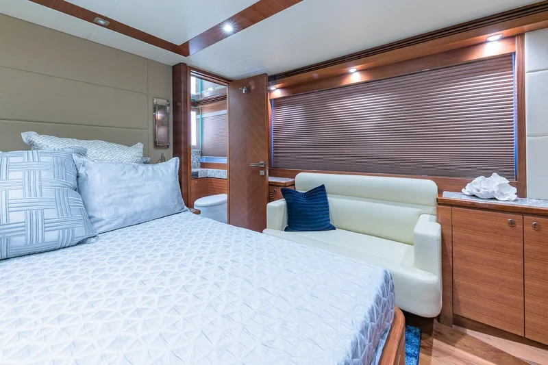  Yacht Photos Pics Luxurious bedroom interior of 2019 Regency P65 yacht with elegant decor and modern furnishings.