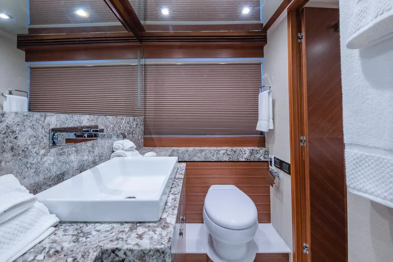  Yacht Photos Pics Luxurious bathroom in 2019 Regency P65 yacht with modern fixtures and elegant design.