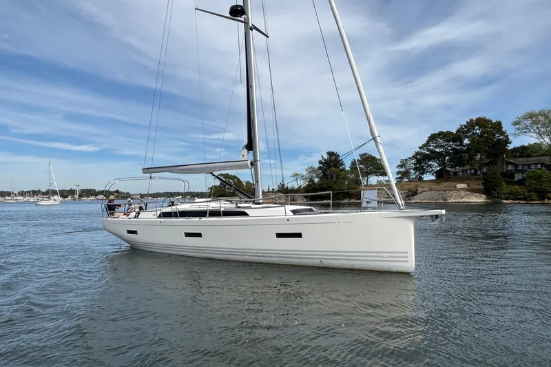 Katara Yacht Photos Pics 2023 X-Yachts X4³ MkII sailboat on calm water, under a clear sky.