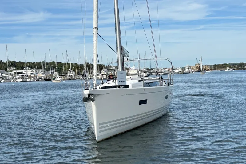 Katara Yacht Photos Pics 2023 X-Yachts X4³ MkII sailboat on calm water, marina in background.