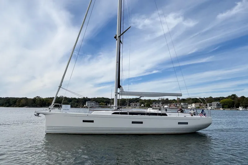 Katara Yacht Photos Pics 2023 X-Yachts X4³ MkII sailboat on calm water under a blue sky.
