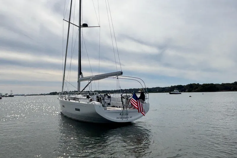 Katara Yacht Photos Pics 2023 X-Yachts X4³ MkII sailboat on calm water with American flag.
