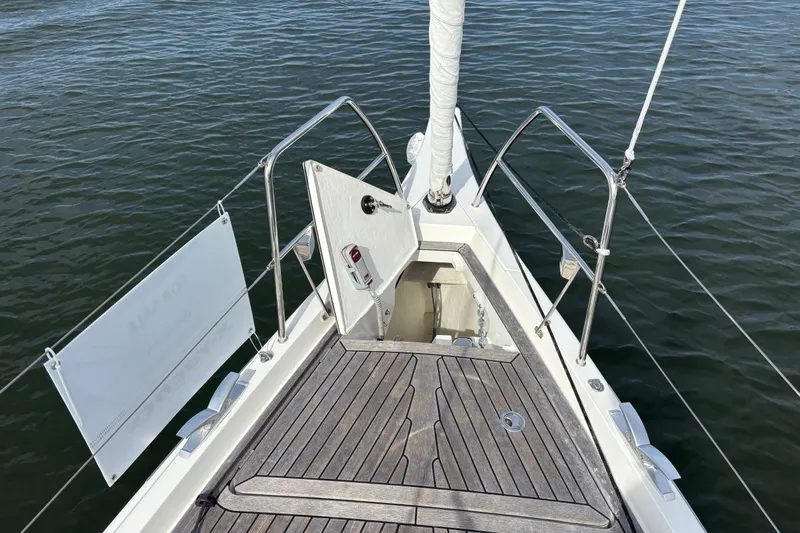 Katara Yacht Photos Pics Bow of 2023 X-Yachts X4³ MkII sailboat with open hatch and teak deck.