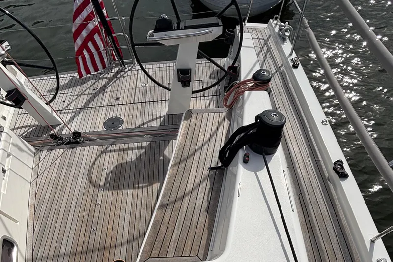 Katara Yacht Photos Pics Deck of 2023 X-Yachts X4³ MkII sailboat with steering wheels and American flag.